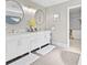 Bright bathroom features double vanity, marble counters, gold accents and view to walk-in closet at 140 Kirkland Dr, Lawrenceville, GA 30044