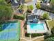 Aerial view of community pool, tennis courts, playground and surrounding neighborhood at 140 Kirkland Dr, Lawrenceville, GA 30044