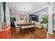 Spacious dining area adjacent to the living room, featuring hardwood floors and plenty of seating at 140 Kirkland Dr, Lawrenceville, GA 30044