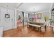 Elegant dining room featuring hardwood floors, ample natural light, and a stylish chandelier at 140 Kirkland Dr, Lawrenceville, GA 30044