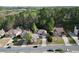 Exterior aerial shot showing a beautiful home with a well-manicured lawn, flowering trees, and a two-car garage at 140 Kirkland Dr, Lawrenceville, GA 30044