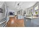 Bright, open kitchen featuring blue cabinets, granite countertops, stainless steel appliances, and hardwood floors at 140 Kirkland Dr, Lawrenceville, GA 30044