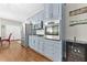 Modern kitchen with stainless steel appliances, sleek cabinetry, and hardwood floors throughout at 140 Kirkland Dr, Lawrenceville, GA 30044