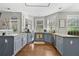 Updated kitchen with granite countertops, stainless steel sink, and stylish gray cabinetry at 140 Kirkland Dr, Lawrenceville, GA 30044