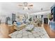 Expansive living room with hardwood floors, a comfortable seating arrangement, and abundant natural light at 140 Kirkland Dr, Lawrenceville, GA 30044