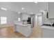 Open kitchen featuring white cabinets, stainless steel appliances, and quartz countertops at 3417 Sable Chase Ln, Atlanta, GA 30349