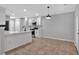Open kitchen featuring white cabinetry, stainless steel appliances, and ample counter space at 3417 Sable Chase Ln, Atlanta, GA 30349