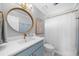 Bright bathroom featuring a vanity, stylish mirror, and shower with curtain at 420 Longs Peak, Johns Creek, GA 30022