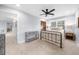 Bedroom featuring carpet, a ceiling fan, and a view of the outdoors at 420 Longs Peak, Johns Creek, GA 30022