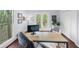 Functional home office featuring a desk, closet, and peaceful views from the windows at 420 Longs Peak, Johns Creek, GA 30022