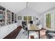 Bright home office with built-in bookshelves, vaulted ceiling, and views of the backyard at 420 Longs Peak, Johns Creek, GA 30022