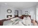 Cozy living room with a fireplace, comfortable seating, and an open layout at 420 Longs Peak, Johns Creek, GA 30022