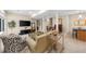 Open living room features neutral walls, hardwood flooring, and comfortable seating and views at 420 Longs Peak, Johns Creek, GA 30022