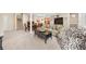 Spacious basement living room featuring open concept layout, including a dining area, and comfortable seating arrangement at 420 Longs Peak, Johns Creek, GA 30022