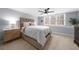 Spacious main bedroom features carpet, neutral colors, a ceiling fan, and plenty of natural light at 420 Longs Peak, Johns Creek, GA 30022