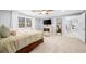 Bedroom featuring a fireplace, a ceiling fan, a TV, and a window at 420 Longs Peak, Johns Creek, GA 30022