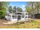 The back of the home has a sunroom, and a stone paver patio with retaining walls at 5361 Seaton Way, Dunwoody, GA 30338