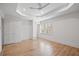 Bright bedroom boasts hardwood floors, a ceiling fan, and ample natural light at 5361 Seaton Way, Dunwoody, GA 30338