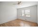 Bright bedroom boasts hardwood floors, a ceiling fan, and ample natural light at 5361 Seaton Way, Dunwoody, GA 30338