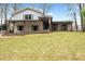 Charming front exterior featuring a wide porch, manicured lawn, and a classic American flag at 5361 Seaton Way, Dunwoody, GA 30338