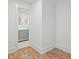 Hallway view leading to bathroom with gray vanity and marble countertops at 5361 Seaton Way, Dunwoody, GA 30338