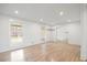 Well-lit living room with hardwood floors and large windows at 5361 Seaton Way, Dunwoody, GA 30338