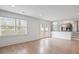 Bright, airy living room with large windows, hardwood floors, and open access to the kitchen at 5361 Seaton Way, Dunwoody, GA 30338