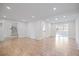 Open living area with hardwood floors and white walls at 5361 Seaton Way, Dunwoody, GA 30338