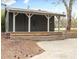 A outbuilding shows a wooden porch with white supports and a dark gray color at 5361 Seaton Way, Dunwoody, GA 30338