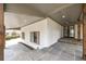 Spacious porch with gray tile flooring, recessed lighting, and exposed wood beams at 5361 Seaton Way, Dunwoody, GA 30338