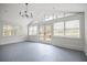 Spacious sunroom with brick floors and multiple windows providing abundant light at 5361 Seaton Way, Dunwoody, GA 30338