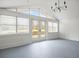 Sunroom with brick floors, chandelier, and plenty of natural light at 5361 Seaton Way, Dunwoody, GA 30338