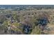 An aerial view of a neighborhood, showing lush trees and homes nestled among nature at 1445 Bentcreek Dr, Marietta, GA 30062