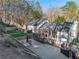 The backyard has multiple tiers with a concrete patio, deck and small patch of green turf at 1445 Bentcreek Dr, Marietta, GA 30062