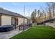 A large hot tub sits next to a deck and a small patch of artificial turf at 1445 Bentcreek Dr, Marietta, GA 30062