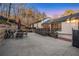 Spacious backyard with a large patio, outdoor seating, and tiered landscaping at 1445 Bentcreek Dr, Marietta, GA 30062