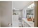 Modern bathroom with a double vanity, skylight, and glass-enclosed shower with marble-style tile at 1445 Bentcreek Dr, Marietta, GA 30062