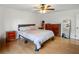 Comfortable bedroom featuring hardwood floors, ceiling fan, and natural light at 1445 Bentcreek Dr, Marietta, GA 30062
