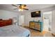 Bright bedroom with wood floors, ceiling fan, TV, and ensuite bathroom at 1445 Bentcreek Dr, Marietta, GA 30062