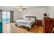 Spacious bedroom featuring hardwood floors, bed, and sliding glass doors to a deck at 1445 Bentcreek Dr, Marietta, GA 30062