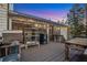 Beautifully designed outdoor deck with BBQ, dining area, and string lights for evening entertaining at 1445 Bentcreek Dr, Marietta, GA 30062