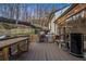 Spacious outdoor deck perfect for entertaining and relaxing, complete with a grill and custom bar at 1445 Bentcreek Dr, Marietta, GA 30062