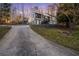 View of house and long driveway leading to the front entrance, surrounded by mature trees at 1445 Bentcreek Dr, Marietta, GA 30062