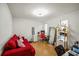 Office featuring hardwood floors, desk, and red sofa at 1445 Bentcreek Dr, Marietta, GA 30062