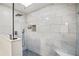 A large walk-in shower features a rainfall shower head and a built-in bench at 1445 Bentcreek Dr, Marietta, GA 30062