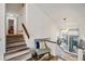 Bright interior stairway featuring contemporary lighting, wood floors, and a comfortable seating area near the landing at 1445 Bentcreek Dr, Marietta, GA 30062