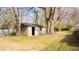 The backyard has a large tree and small outdoor building at 1751 Tiger Flowers Nw Dr, Atlanta, GA 30314