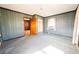 The bedroom has a window, carpet, and vertical wood paneling at 1751 Tiger Flowers Nw Dr, Atlanta, GA 30314
