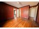 The bedroom has hardwood floors and vertical wood paneling at 1751 Tiger Flowers Nw Dr, Atlanta, GA 30314
