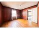 The bedroom has hardwood floors and vertical wood paneling at 1751 Tiger Flowers Nw Dr, Atlanta, GA 30314